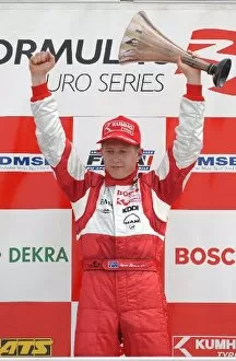 Images Dated 12th May 2003: Ryan Briscoe (AUS) Prema Powerteam celebrates his victory on the podium