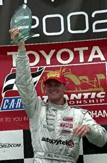 Images Dated 1st July 2002: Ryan Hunter-Reay with the winners trophy at the toyota Atlantic race at the CART Grand Prix of