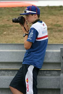 Images Dated 15th August 2008: Scott Redding gets a bit of photography in during the MotoGP practice session