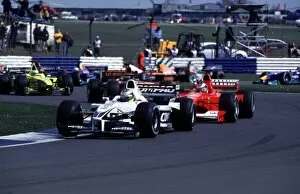 Images Dated 9th October 2013: Silverstone, England. 21st - 23rd April 2000: Ralf Schumacher leads his brother Michael at