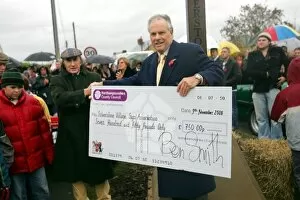 Images Dated 9th November 2008: Silverstone Sign Unveiling: A cheque from Northamptonshire County Council is presented to Sir