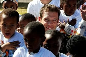Images Dated 6th August 2004: Unite Against Hunger: Alex Wurz McLaren Mercedes children at a school in Soweto which is being