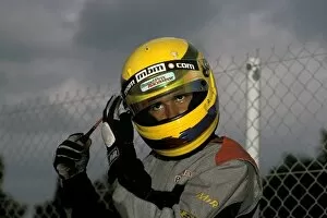 Images Dated 22nd January 2008: World Karting Championships: Lewis Hamilton makes an adjustment to his helmet