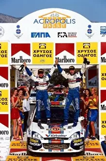 Images Dated 18th June 2001: World Rally Championship: Colin McRae and Niki Grist celebrate on the podium