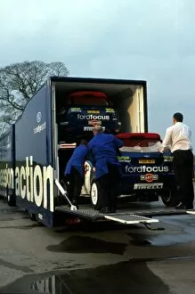 Cyprian Collection: World Rally Championship: Two Ford Focus WRC cars are loaded onto a transporter