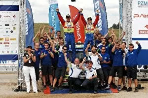 Images Dated 28th June 2009: World Rally Championship: The Ford team celebrate on the podium after Mikko Hirvonen took victory