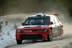 Images Dated 5th February 2004: World Rally Championship: Gilles Panizzi / Herve Panizzi Mitsubishi Lancer WRC04