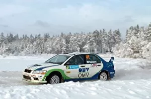 Images Dated 8th February 2004: World Rally Championship: Jani Psonen with co-driver Sirkka Rautiainen Mitsubishi Lancer EVO VII