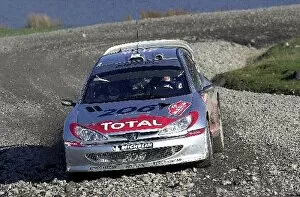 Images Dated 8th November 2003: World Rally Championship: Juuso Pykalisto with co-driver Esko Mertsalmi Peugeot 206 WRC in action
