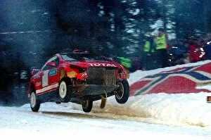 Images Dated 8th February 2004: World Rally Championship: Marcus Gronholm with co-driver Timo Rautiainen Peugeot 307 WRC having