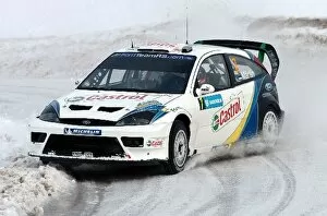 Images Dated 6th February 2004: World Rally Championship: Markko Martin with co-driver Michael Park Ford Focus WRC03 on stage one