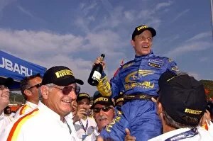 2004 WRC Gallery: World Rally Championship: Rally winner Petter Solberg, Subaru, celebrates with Pirelli