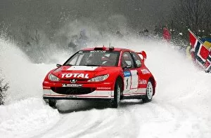 Images Dated 10th February 2003: World Rally Championship: Rally winners Marcus Gronholm / Timo Rautiainen Peugeot 206 WRC
