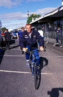 Images Dated 9th October 2002: World Rally Championship: Richard Burns Peugeot, cycles through the service area after losing his