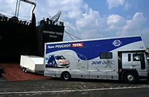 Cyprian Collection: World Rally Championship: A Team Peugeot Total support vehicle is loaded onto The Southern Trader'