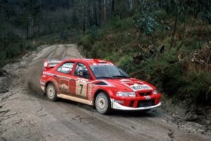 Images Dated 12th March 2001: World Rally Championship: Winners Tommi Makinen / Risto Mannisenmaki, Mitsubishi Lancer Evo