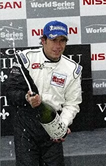Jarama Collection: World Series By Nissan: Enrique Bernoldi, Team GD Racing, sprays champagne on the podium after